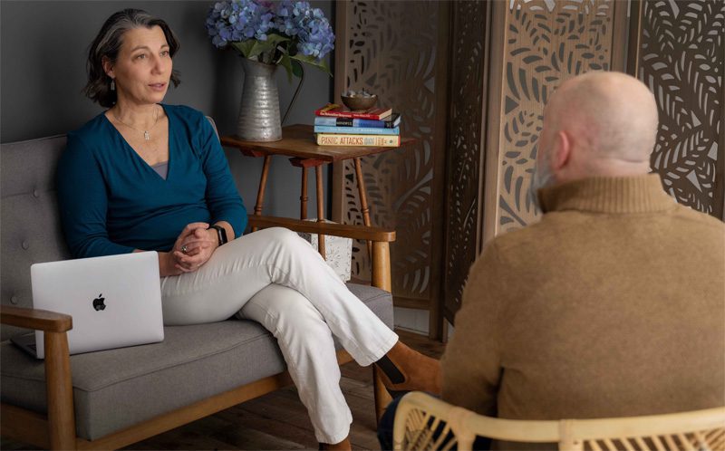 Karen Lane in a therapy session with a man