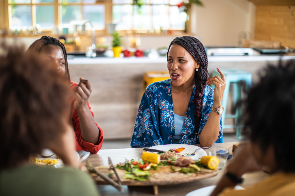 Friends connecting over a vegan meal as they find balance in their life